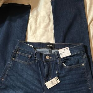 EXPRESS Barely Boot stretch Mid Rise dark blue jeans. NWT